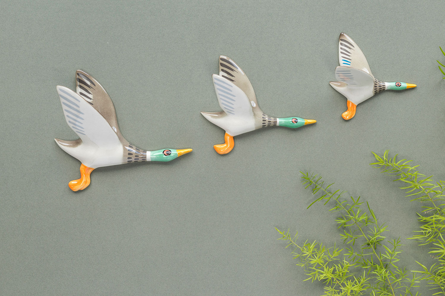 Handmade ceramic flying duck trio wall art by hannah turner