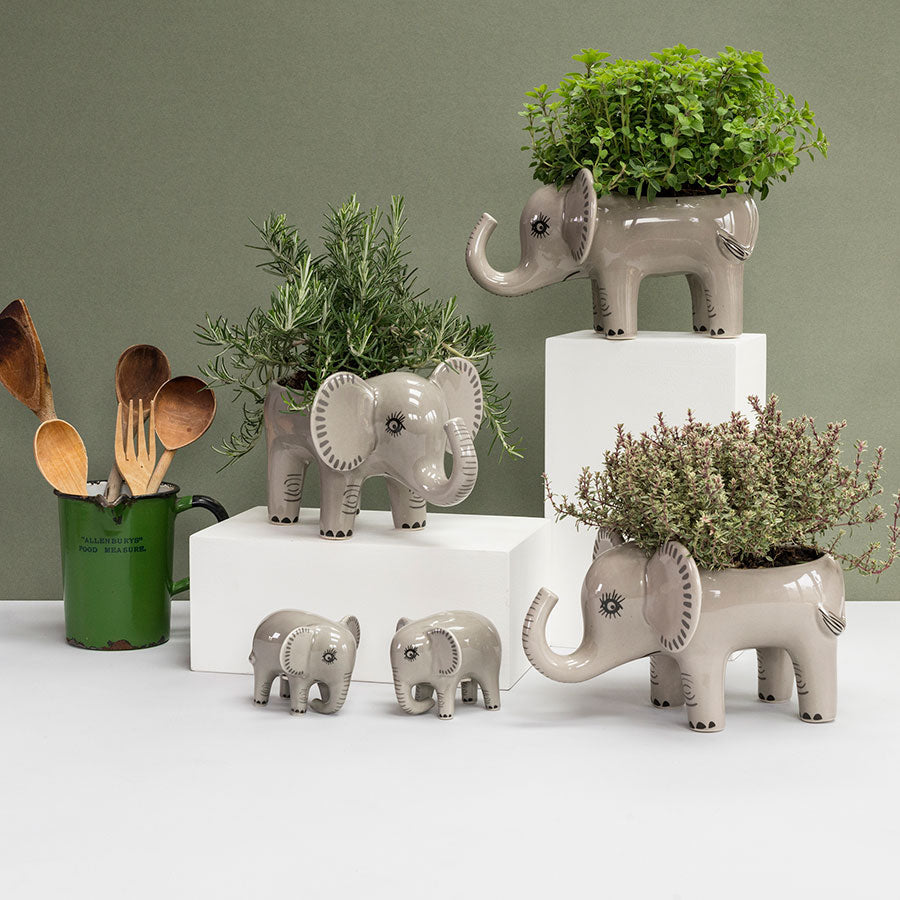 Grey Ceramic Elephant Collection With Sage Green Background Made by Hannah Turner 