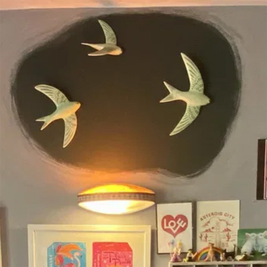 Green swift trio on a customer's wall