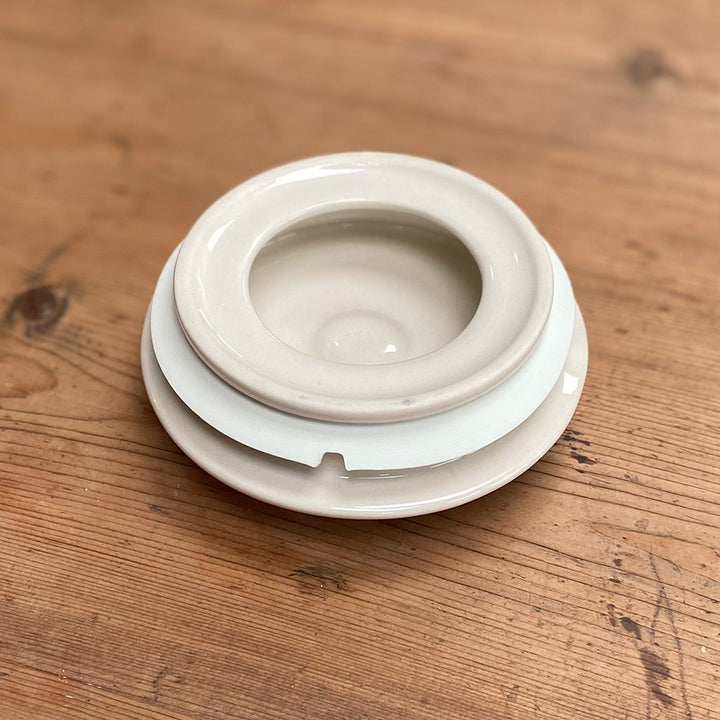 White ceramic bowl on a wooden surface