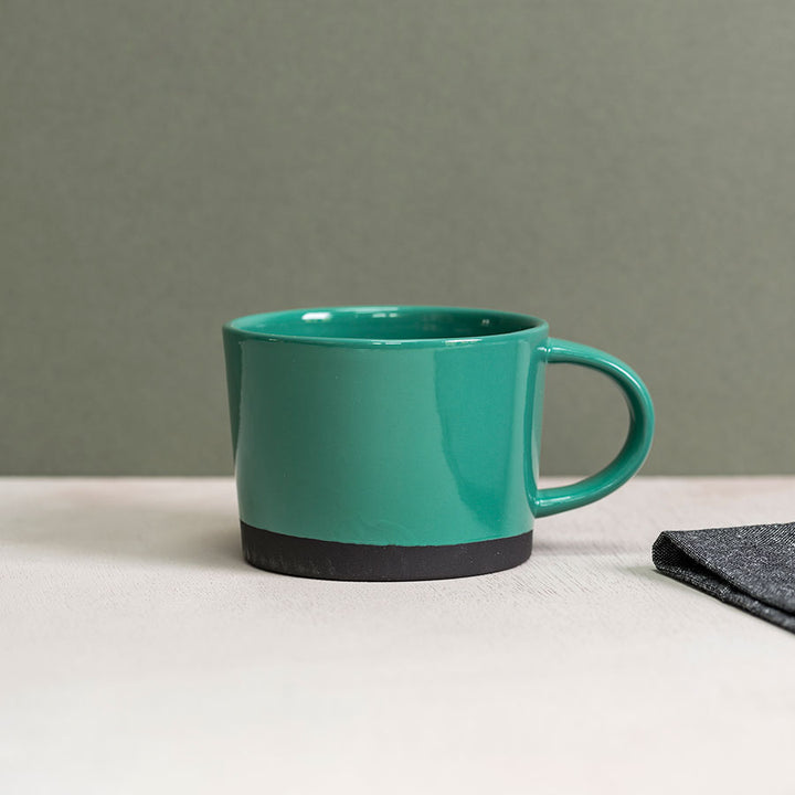 Black Clay Mug dipped in Green Glaze by Hannah Turner