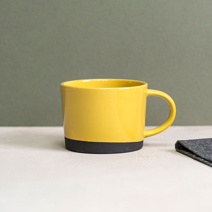 Black Clay Mug dipped in Yellow Glaze by Hannah Turner