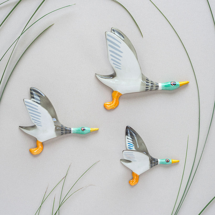 handmade ceramic flying duck trio wall art, by hannah turner