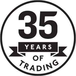 A circular black and white graphic featuring the text '35 YEARS OF TRADING' with large '35' and ribbon banners.