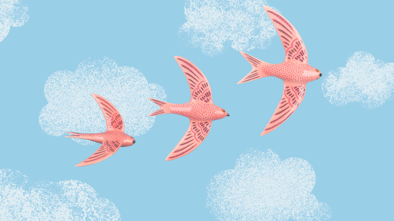 3 pink ceramic swifts flying on a blue sky
