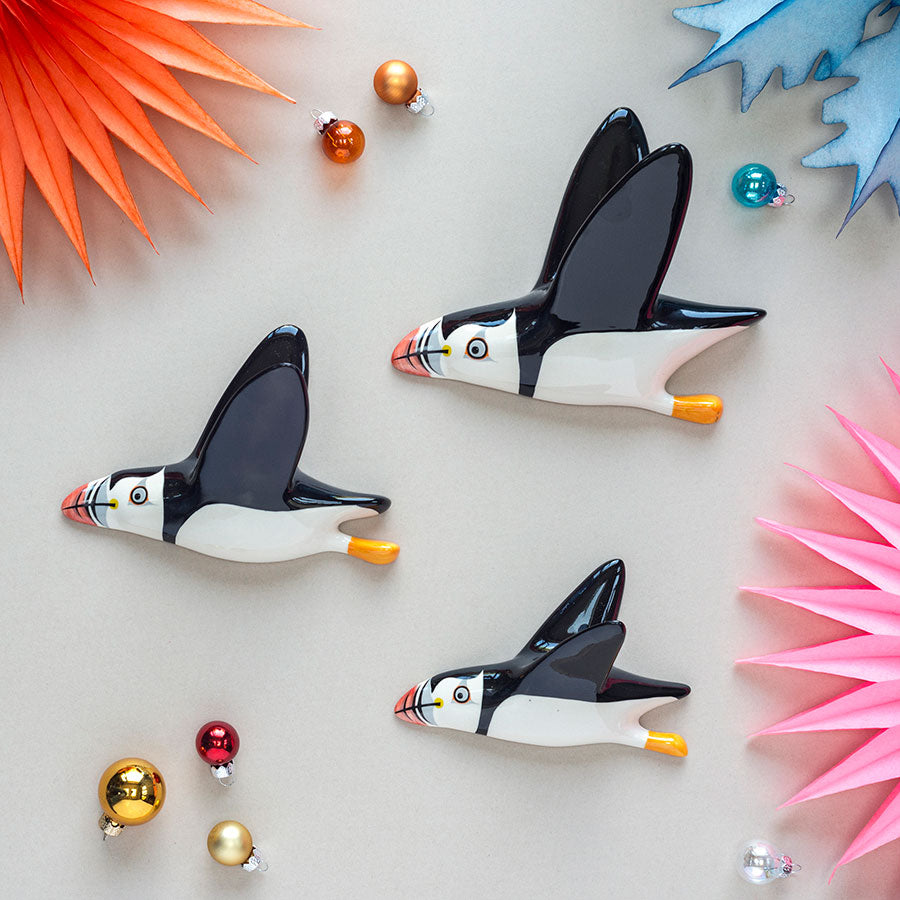 Wall Mounted set of 3 ceramic flying Puffins by Hannah Turner